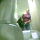A low-quality video clip in which a hidden camera hidden on the floor behind a toilet records an unsuspecting woman pooping, then wiping her ass. There is audio, but somewhat muffled.